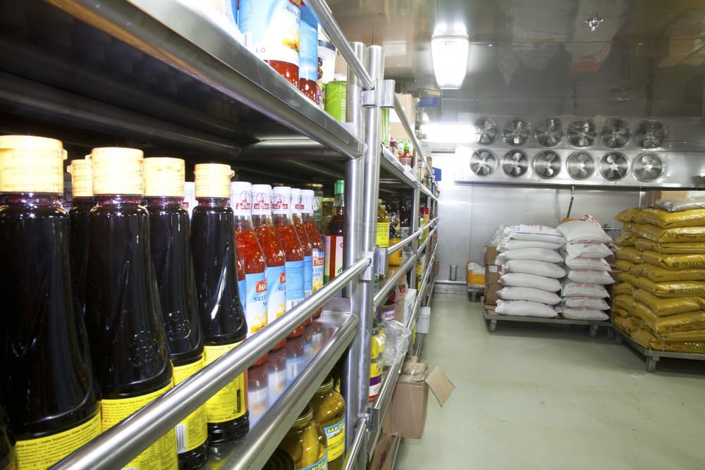 Shelves stocked with supplies in a ships galley